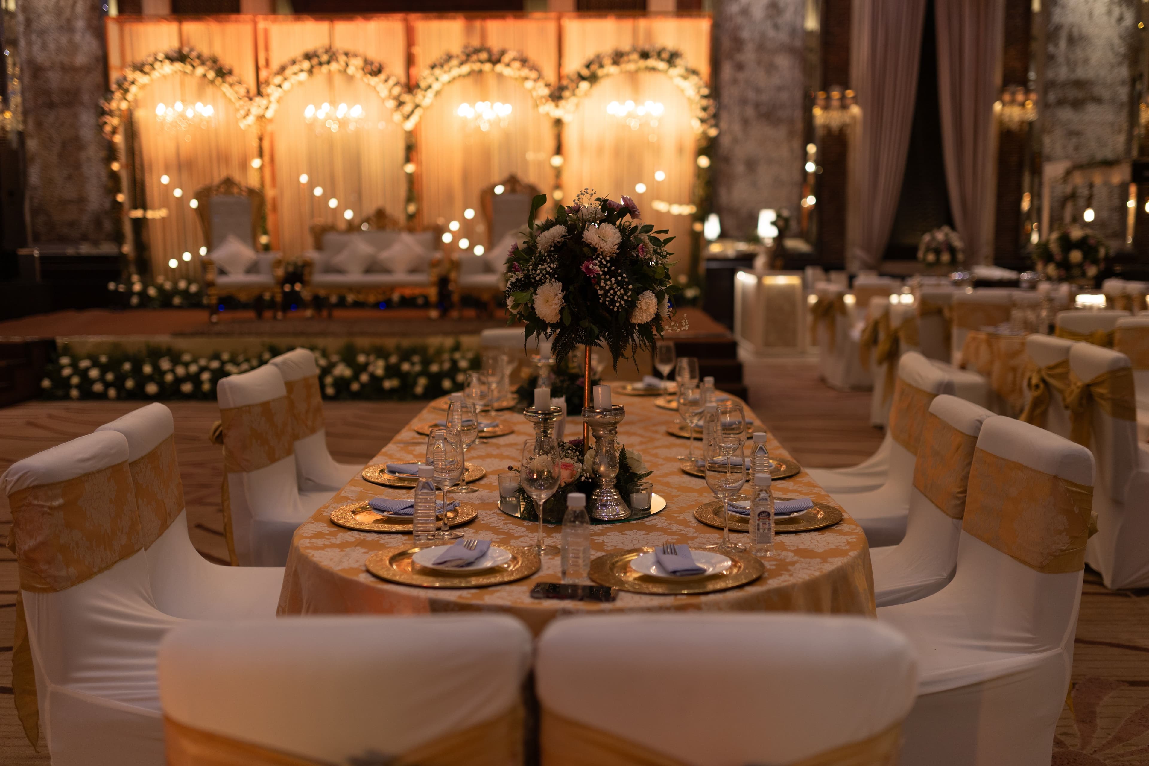 Decorated wedding reception hall with elegant floral arrangements