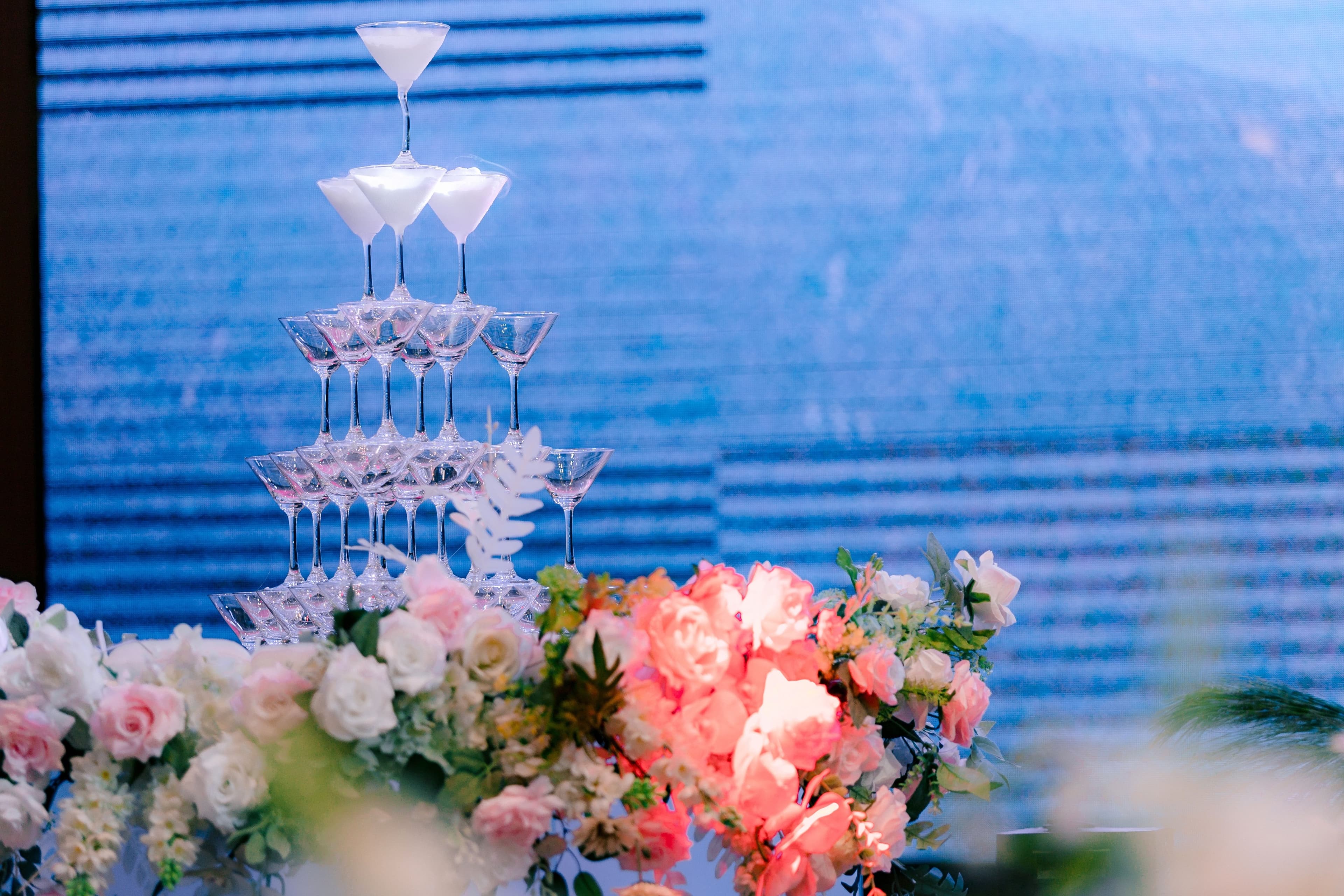 Elegant champagne tower with beautiful floral arrangements
